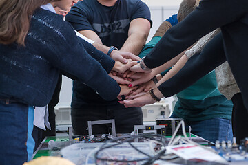 Image showing students celebrating successfully finished project