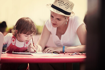 Image showing mom and little daughter drawing a colorful pictures