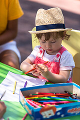 Image showing little girl drawing a colorful pictures