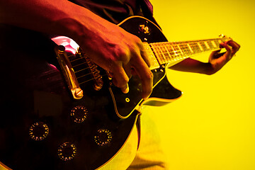 Image showing Young african-american jazz musician playing the guitar