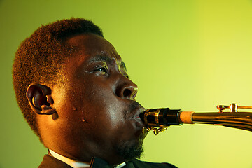 Image showing Young african-american jazz musician playing the saxophone