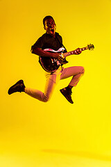 Image showing Young african-american jazz musician playing the guitar