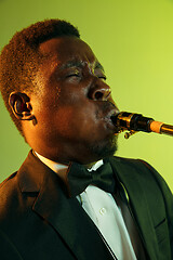 Image showing Young african-american jazz musician playing the saxophone