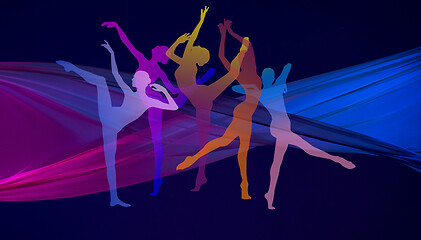 Image showing Silhouettes of young graceful female ballet dancers on dark background