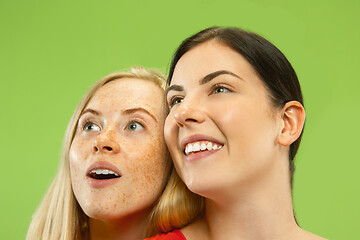 Image showing Portrait of pretty girls isolated on green studio background