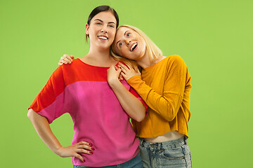 Image showing Portrait of pretty girls isolated on green studio background