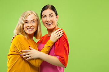 Image showing Portrait of pretty girls isolated on green studio background