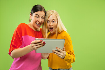 Image showing Portrait of pretty girls isolated on green studio background