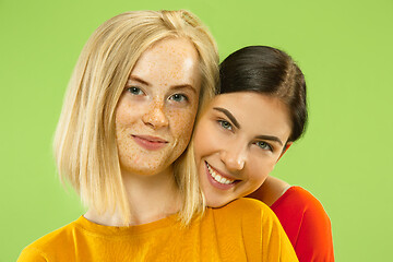 Image showing Portrait of pretty girls isolated on green studio background