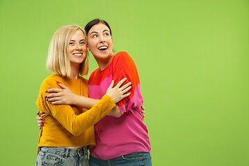 Image showing Portrait of pretty girls isolated on green studio background