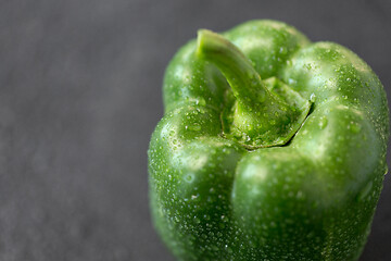 Image showing close up of green pepper on slate stone background