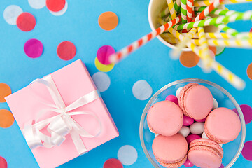 Image showing birthday gift, macarons and paper straws for party