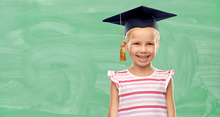 Image showing happy school girl in bachelor hat or mortarboard