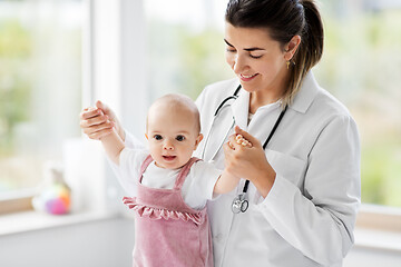 Image showing female pediatrician doctor with baby at clinic