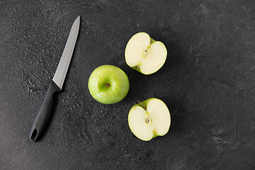 Image showing green apples and kitchen knife on slate background