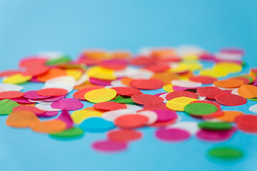 Image showing colorful confetti decoration on blue background