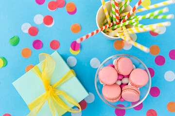 Image showing birthday gift, macarons and paper straws for party