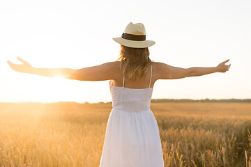 Image showing happy woman in straw hat on cereal field in summer