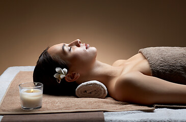 Image showing young woman lying at spa or massage parlor