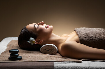 Image showing young woman lying at spa or massage parlor