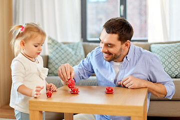 Image showing father and daughter playing tea party at home