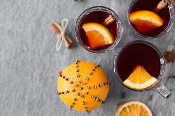 Image showing hot mulled wine, orange slices, raisins and spices