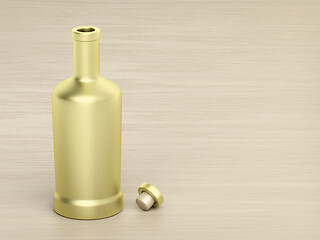 Image showing Gold bottle on wood table