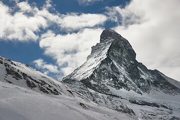 Image showing Matterhorn winter landscape with clouds moving