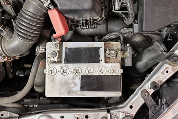 Image showing Old starter battery in a car