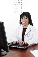 Image showing Eye doctor at computer