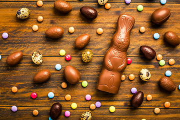 Image showing Chocolate Easter bunny with sweet chocolate eggs and colorful sweets