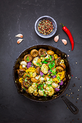 Image showing Roasted mushrooms and cauliflower, with onion and herbs in pan