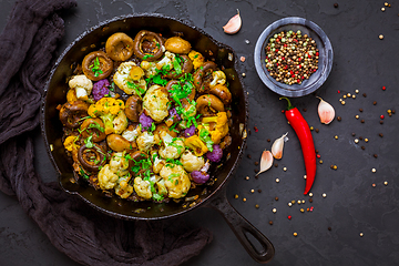 Image showing Roasted mushrooms and cauliflower, with onion and herbs in pan