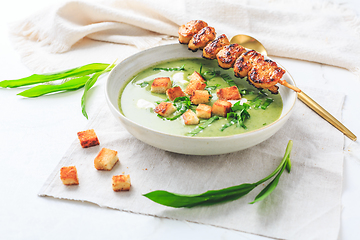 Image showing Ramson or bear leek soup with crouton, sour cream and turkey skewer