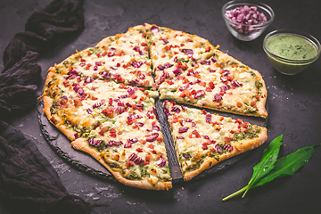 Image showing Tart flambee (Flammkuchen) with ramson sour cream, onion and bacon