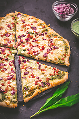 Image showing Tart flambee (Flammkuchen) with ramson sour cream, onion and bacon