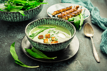 Image showing Bear leek soup or ramson soup with crouton, sour cream and turkey skewer