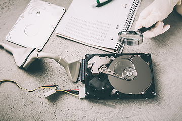Image showing Concept of data recovery,  engineer is recovering data from failed hard disk driver