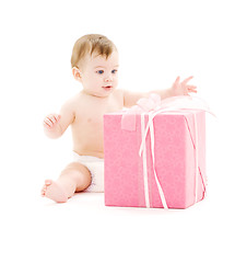 Image showing baby boy in diaper with big gift box