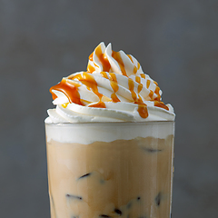 Image showing iced coffee latte with whipped cream and caramel sauce