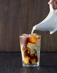 Image showing glass of iced coffee with milk