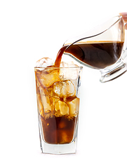 Image showing coffee pouring into glass of ice