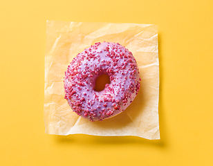 Image showing pink donut on yellow background