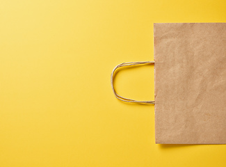 Image showing paper bag on yellow background