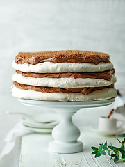 Image showing homemade meringue and nut cake with chocolate cream