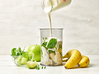 Image showing cook adding yogurt into blender container