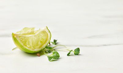 Image showing fresh greens and squeezed lime slice