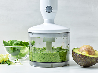 Image showing avocado, celery and spinach in plastic transparent blender conta