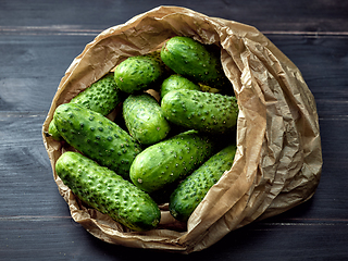 Image showing fresh green cucumbers in paper bag
