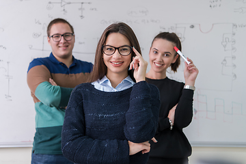 Image showing portrait of young students in front of chalkboard